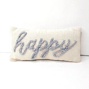 Happy embroidered throw pillow. Off white/blue